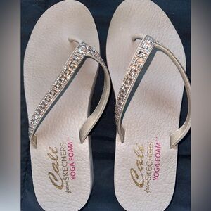 Sketchers bling flip flops.